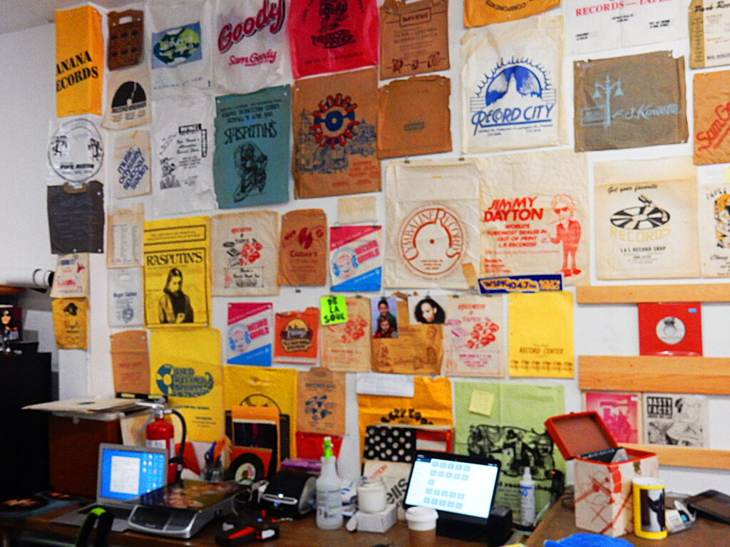 A wall of record store bags from long gone stores
